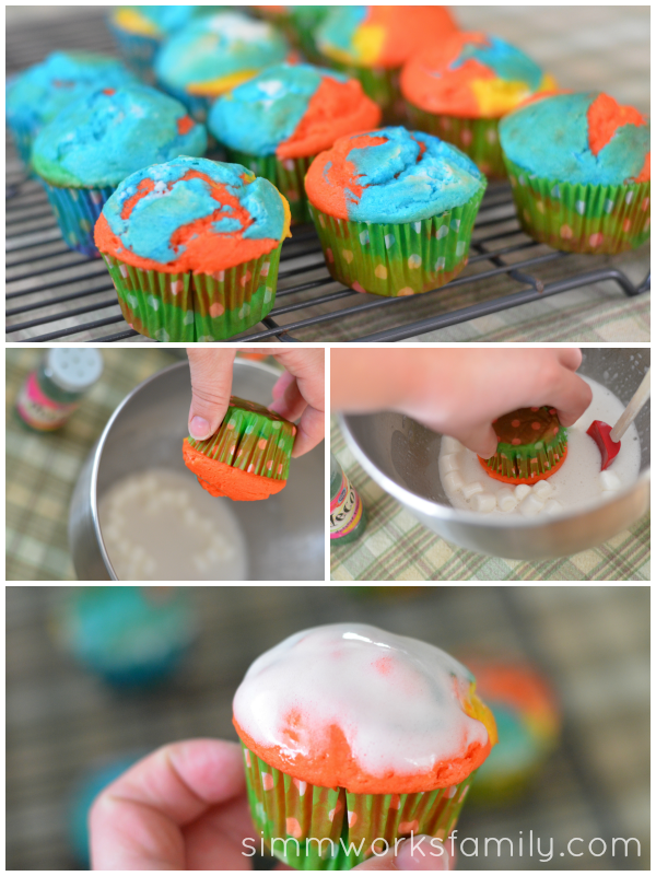 Rainbow Cupcakes dip in frosting