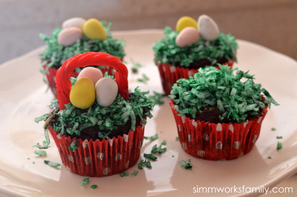 Easter Egg Cupcake Baskets adding licorice handle