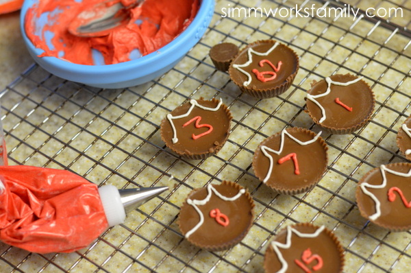 March Madness Basketball Cupcakes piping on numbers