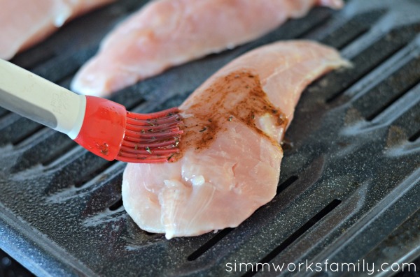 Herb Roasted Turkey Breast Tenderloin applying rub