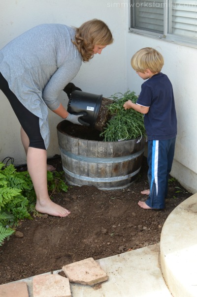 Gardening with Kids pulling out the lavender plant