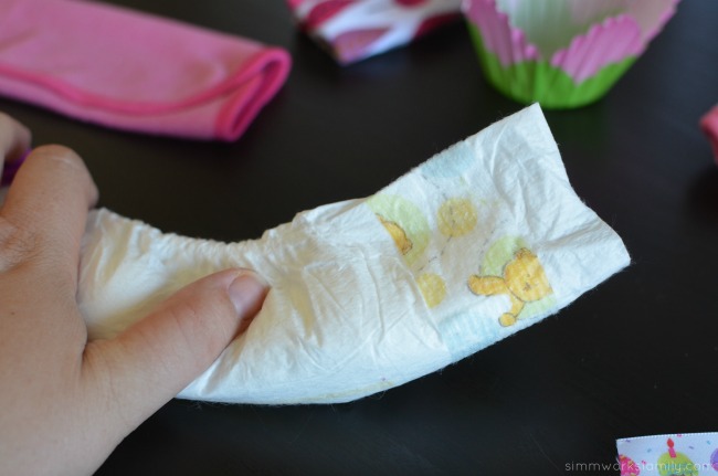 How to Make Diaper Cupcakes - fold diaper in half lengthwise
