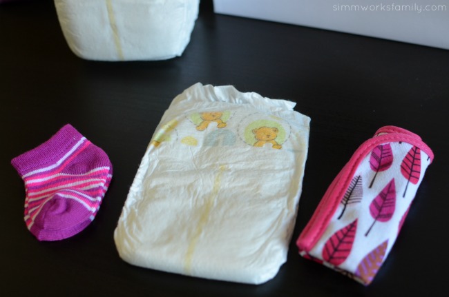 How to Make Diaper Cupcakes - start with socks, diaper, and washcloth