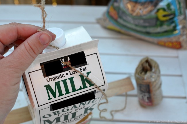 DIY Milk Carton Bird Feeder - thread twine on top